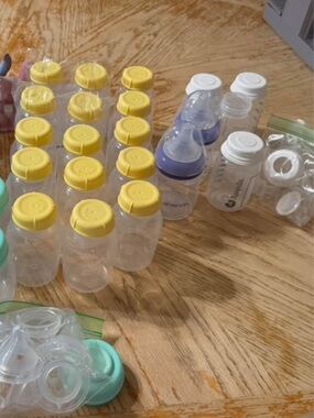Assorted Baby Feeding Bottles in Yellow and White Caps